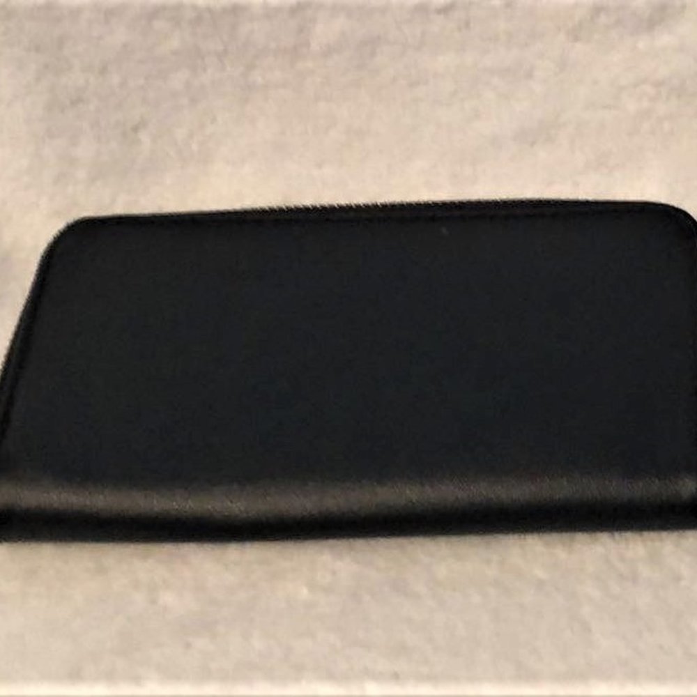 Black Wallet with a Fluffy Ball
